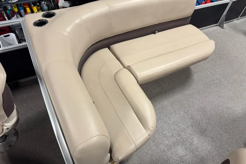 Slide: The Image of 2018 Sun Tracker Bass Buggy 18 DLX beige seating with cup holders, interior view. - 17