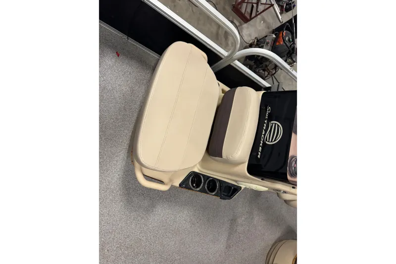 Slide: The Image of 2018 Sun Tracker Bass Buggy 18 DLX boat seat with beige upholstery and cup holders. - 7