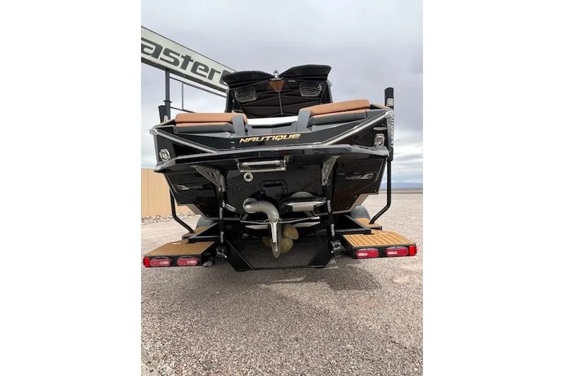Slide: The Image of 2025 Nautique Super Air Nautique G23 boat rear view, showcasing sleek design and propeller. - 5