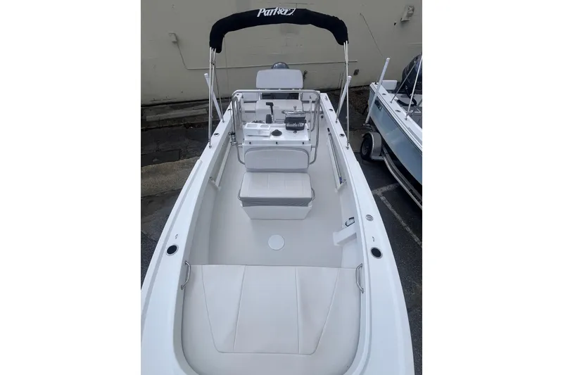 Slide: The Image of 2026 Parker 210 Coastal boat dashboard with Garmin navigation and steering wheel. - 8