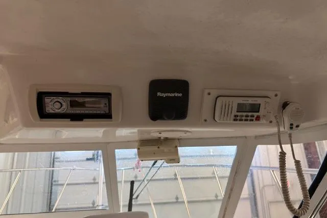 Slide: The Image of 2006 Baha Cruisers 277 GLE dashboard with Raymarine electronics and radio system. - 10