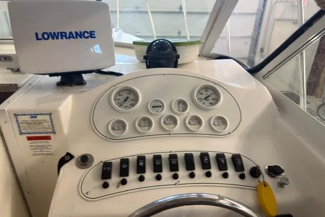 Slide: The Image of 2006 Baha Cruisers 277 GLE dashboard with gauges and Lowrance navigation system. - 15