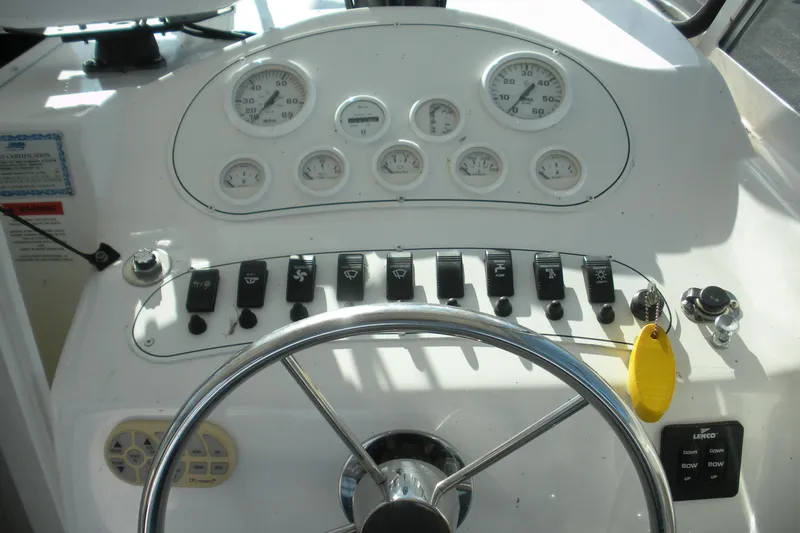 Slide: The Image of 2006 Baha Cruisers 277 GLE dashboard with steering wheel and control panel. - 16