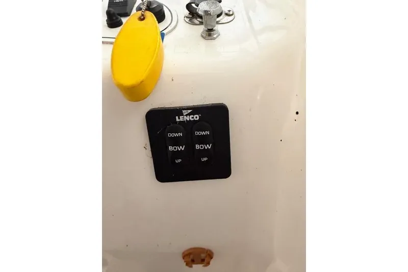 Slide: The Image of Control panel of a 2006 Baha Cruisers 277 GLE boat with Lenco trim tab switches. - 18