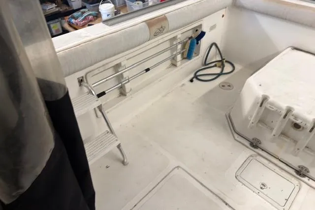 Slide: The Image of 2006 Baha Cruisers 277 GLE boat interior with ladder and storage compartments. - 23