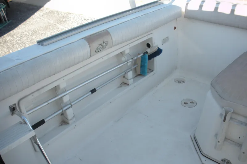 Slide: The Image of 2006 Baha Cruisers 277 GLE boat interior with seating and storage area. - 24