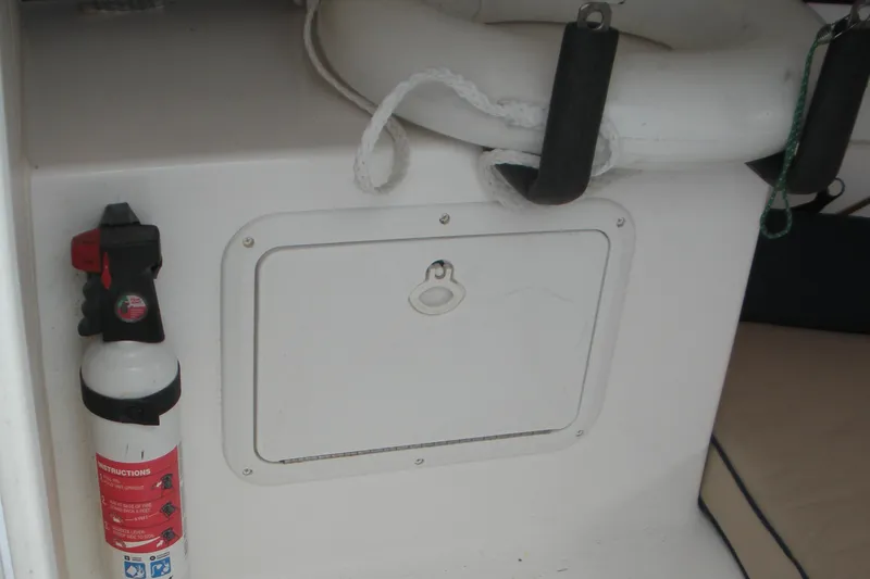 Slide: The Image of 2006 Baha Cruisers 277 GLE boat interior with fire extinguisher and life preserver. - 8