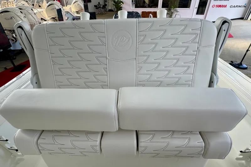 Slide: The Image of 2026 Parker 230 Coastal Elite boat seat with stylish white upholstery and embossed logo. - 6