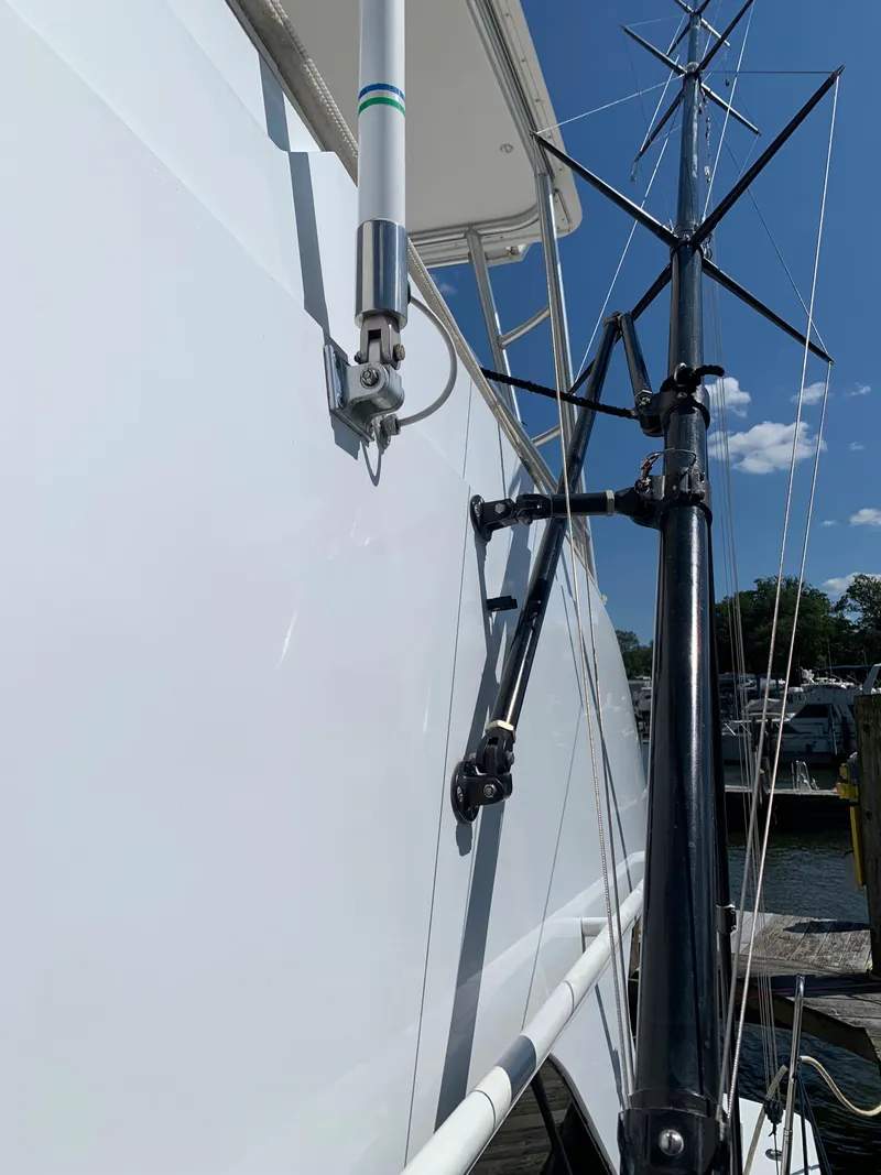 Slide: The Image of Viking 50 Convertible 2000 yacht with antenna and mast against blue sky. - 14