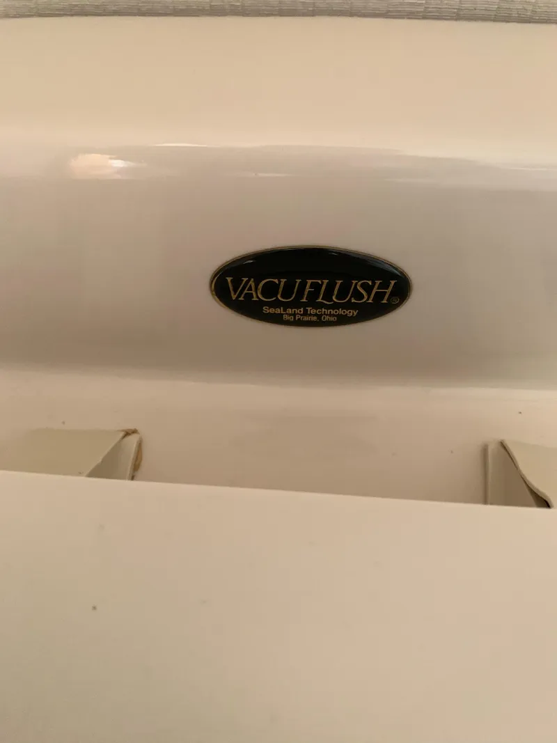 Slide: The Image of VacuFlush system in a 2000 Viking 50 Convertible yacht bathroom. - 32