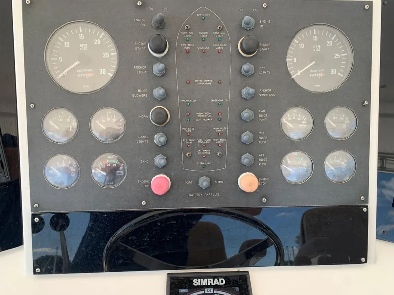 Slide: The Image of Control panel of a 2000 Viking 50 Convertible boat with Simrad navigation system. - 46