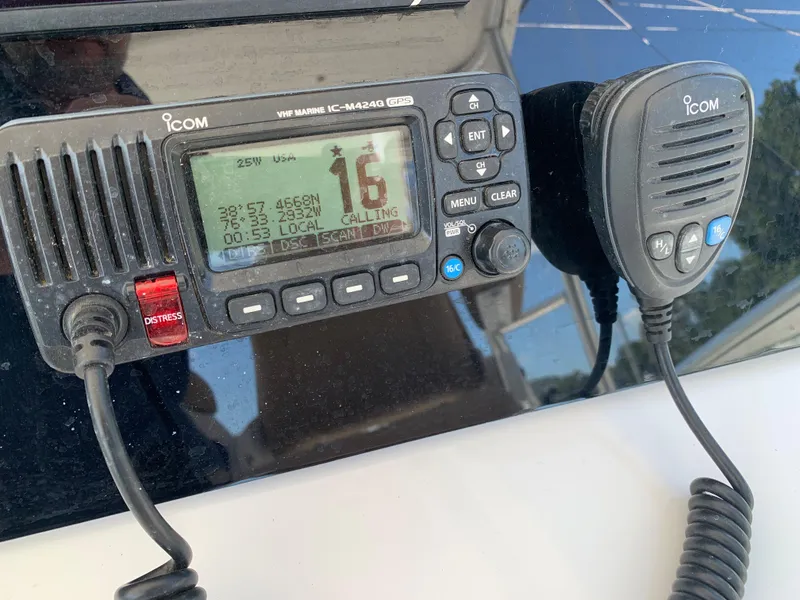 Slide: The Image of VHF marine radio on a 2000 Viking 50 Convertible boat dashboard. - 48