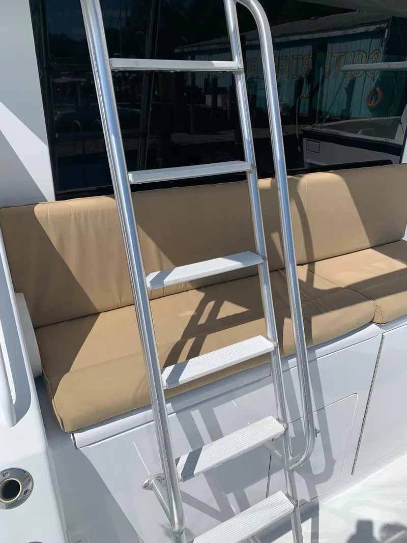 Slide: The Image of Ladder on a 2000 Viking 50 Convertible yacht with beige seating. - 5