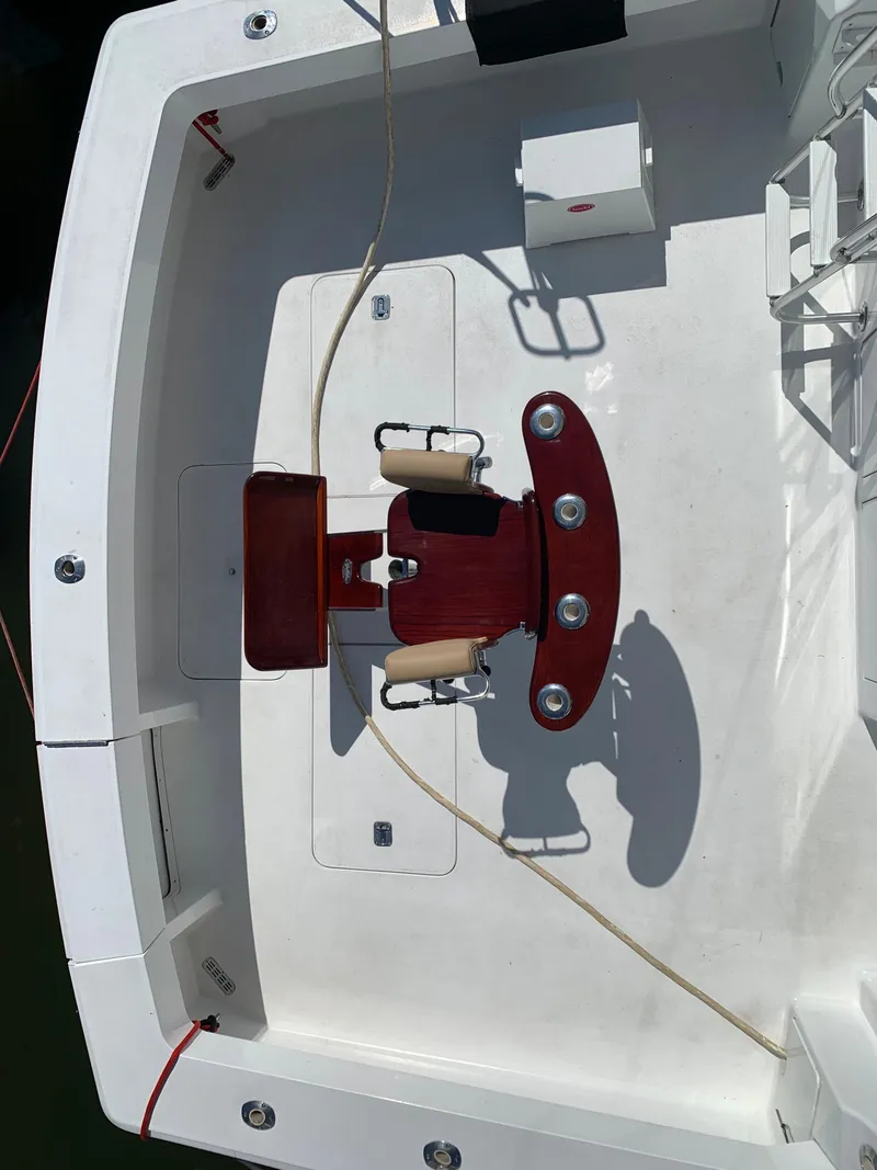 Slide: The Image of Overhead view of a 2000 Viking 50 Convertible yacht's deck with fishing chair. - 8