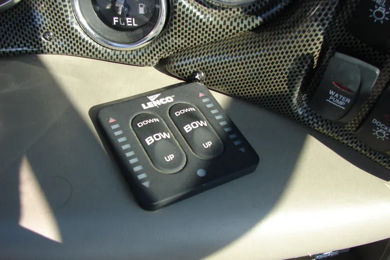 Slide: The Image of Lenco trim tab controls on 2008 Crownline 270 BR boat dashboard. - 17