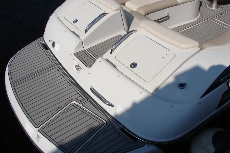 Slide: The Image of 2008 Crownline 270 BR boat with sleek deck design and comfortable seating. - 18