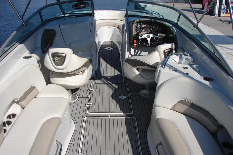 Slide: The Image of 2008 Crownline 270 BR boat interior with luxurious seating and modern dashboard. - 19
