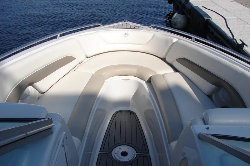 Slide: The Image of 2008 Crownline 270 BR boat interior with cushioned seating and sleek design. - 23