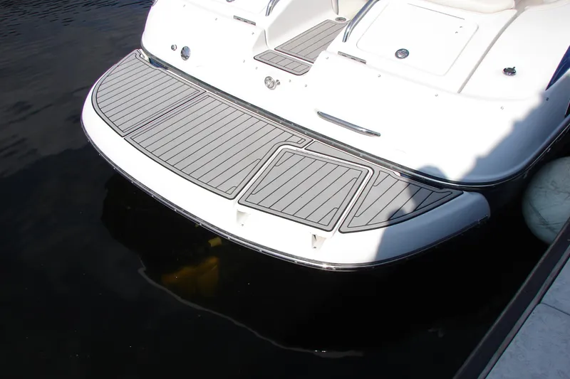 Slide: The Image of 2008 Crownline 270 BR boat with sleek swim platform on calm water. - 30
