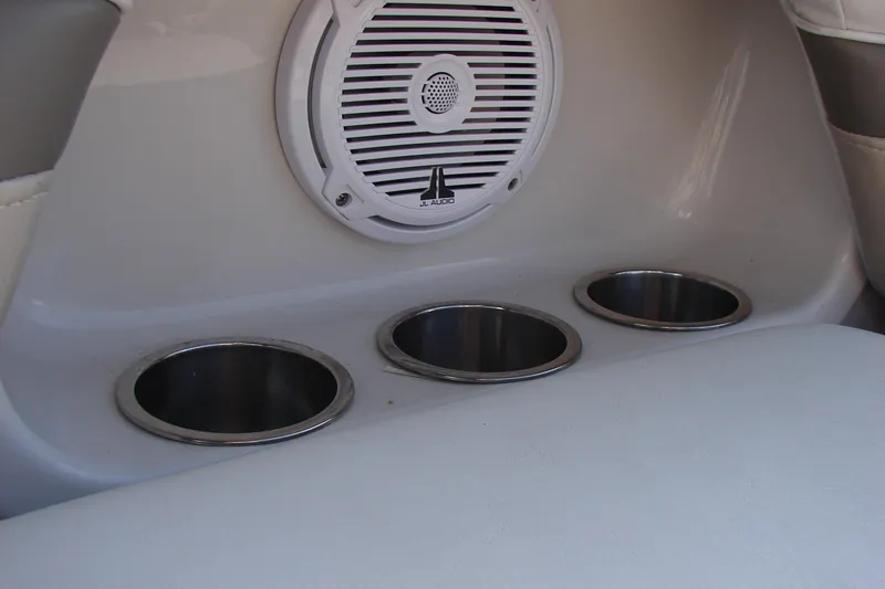 Slide: The Image of Speaker and cup holders on 2008 Crownline 270 BR boat interior. - 33