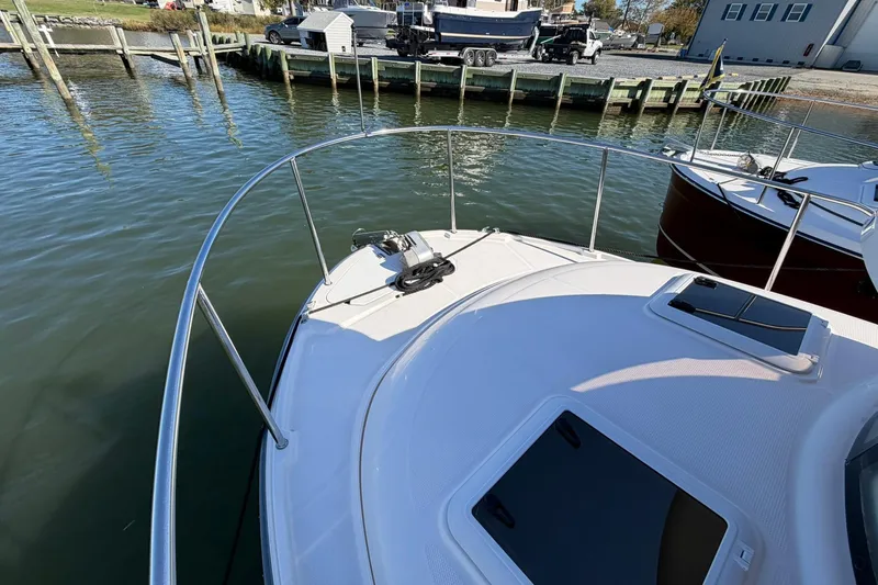 Slide: The Image of 2023 Ranger Tugs R-25 boat bow view at a marina dock. - 14
