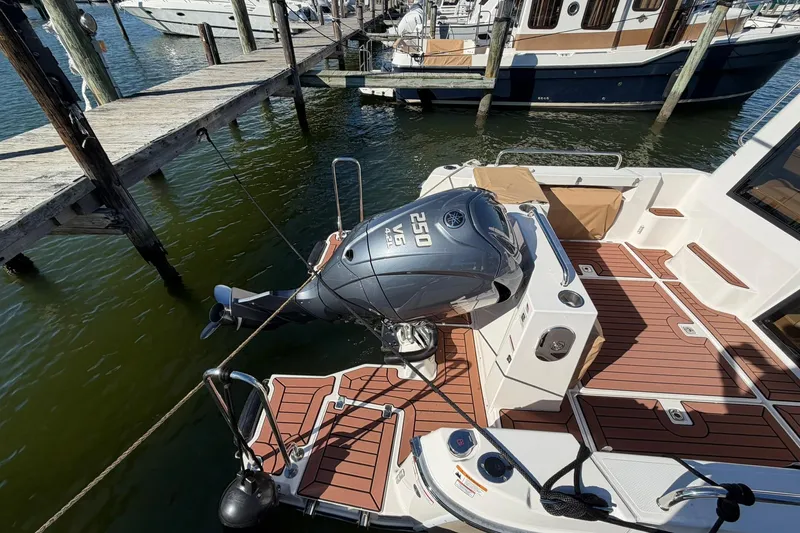 Slide: The Image of 2023 Ranger Tugs R-25 boat with Yamaha 250 engine docked at marina. - 19
