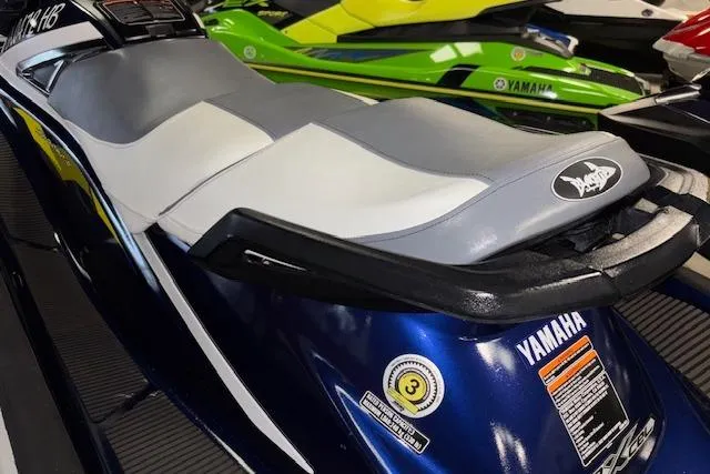 Slide: The Image of 2017 Yamaha WaveRunner VX Deluxe, blue and white seat, displayed indoors. - 11