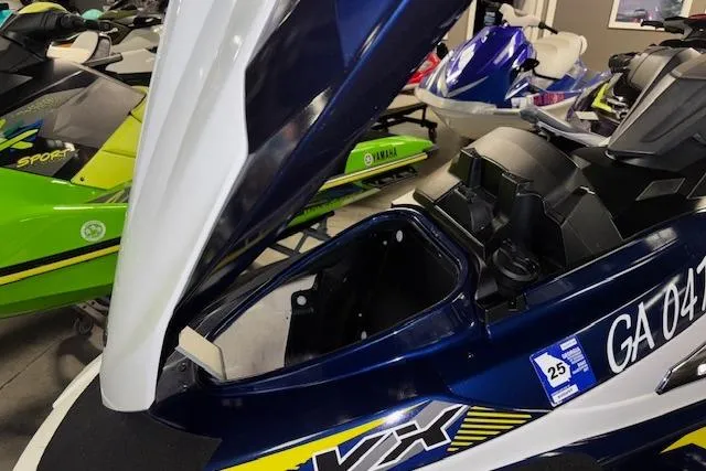 Slide: The Image of 2017 Yamaha WaveRunner VX Deluxe with open storage compartment in a showroom. - 14
