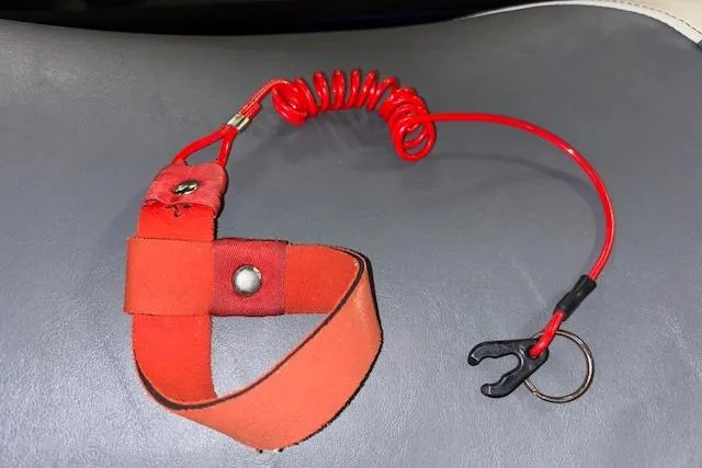 Slide: The Image of Red safety lanyard for 2017 Yamaha WaveRunner VX Deluxe on gray surface. - 17