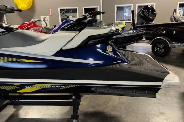 Slide: The Image of 2017 Yamaha WaveRunner VX Deluxe in showroom, side view, blue and white design. - 5