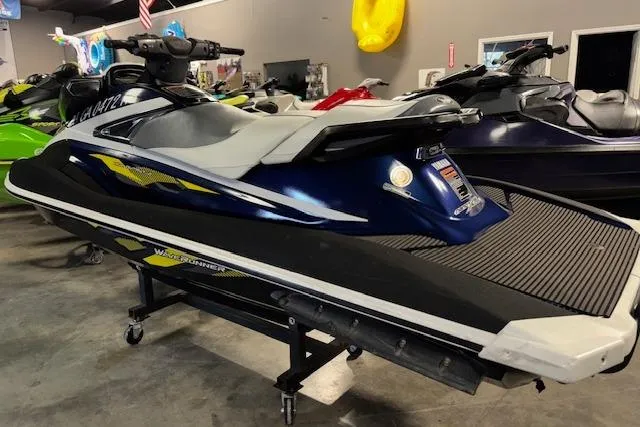 Slide: The Image of 2017 Yamaha WaveRunner VX Deluxe in showroom, blue and white design, side view. - 6