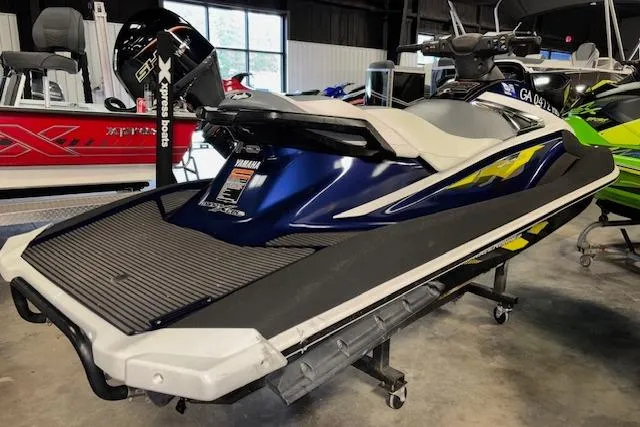 Slide: The Image of 2017 Yamaha WaveRunner VX Deluxe in showroom, blue and white design, side view. - 7