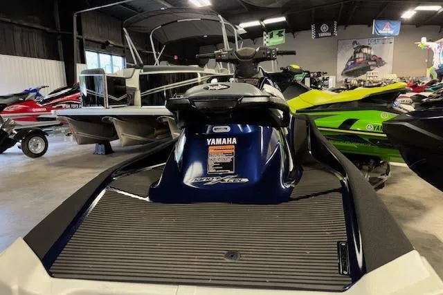 Slide: The Image of 2017 Yamaha WaveRunner VX Deluxe in showroom, surrounded by other watercraft. - 8