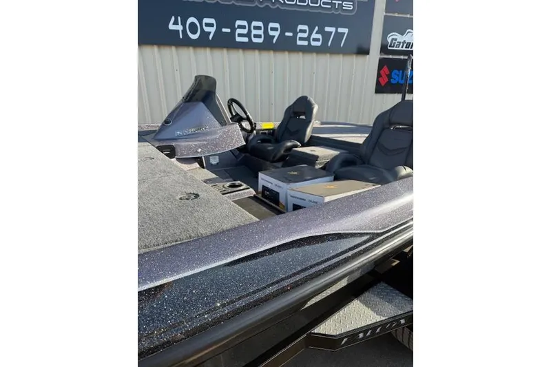 Slide: The Image of 2025 Falcon Boats F21 Predator interior with dual seats and control panel. - 4