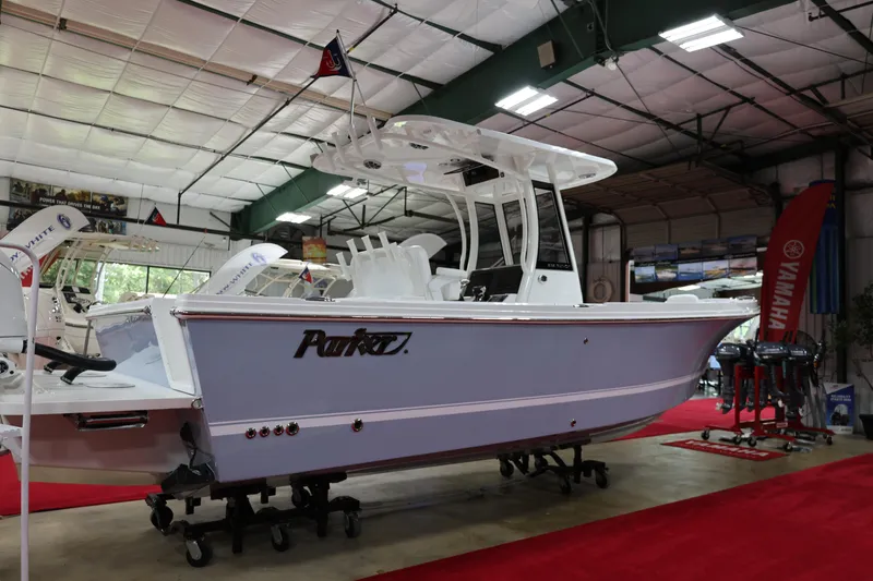 The Image of 2026 Parker 274 Fathom boat displayed indoors on red carpet. - 1
