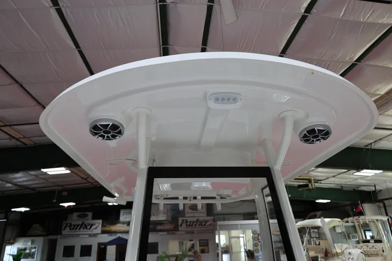 Slide: The Image of 2026 Parker 274 Fathom boat interior, featuring speakers and lighting under the canopy. - 15