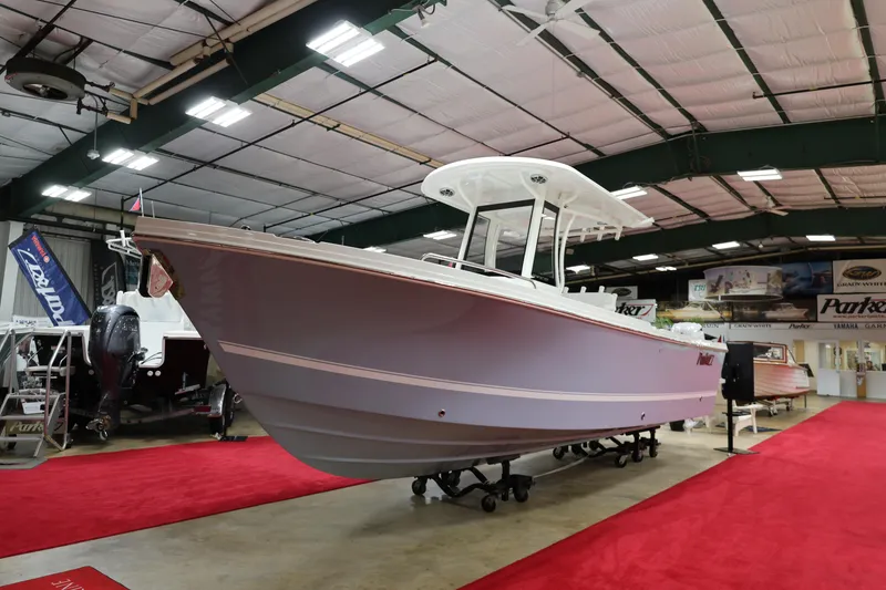 Slide: The Image of 2026 Parker 274 Fathom boat displayed indoors on red carpet. - 4