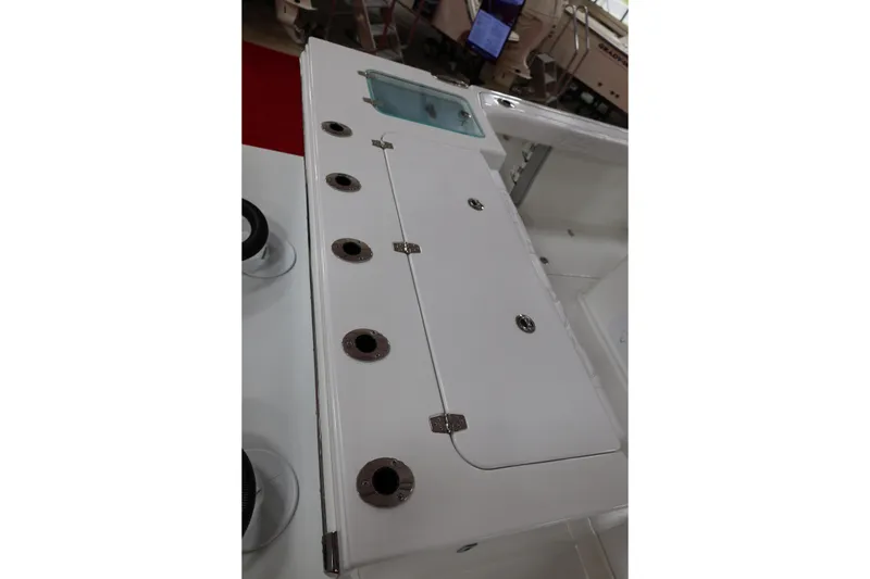 Slide: The Image of 2026 Parker 274 Fathom boat deck with storage compartments and rod holders. - 6