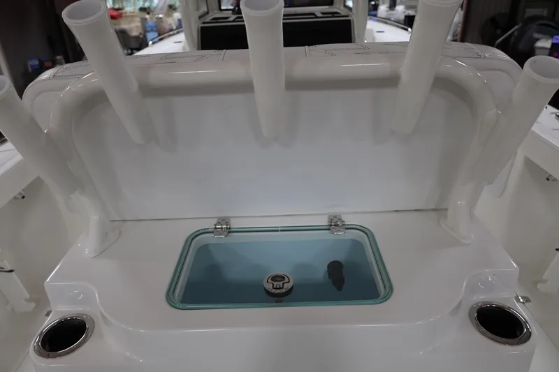 Slide: The Image of 2026 Parker 274 Fathom boat interior with rod holders and livewell. - 9