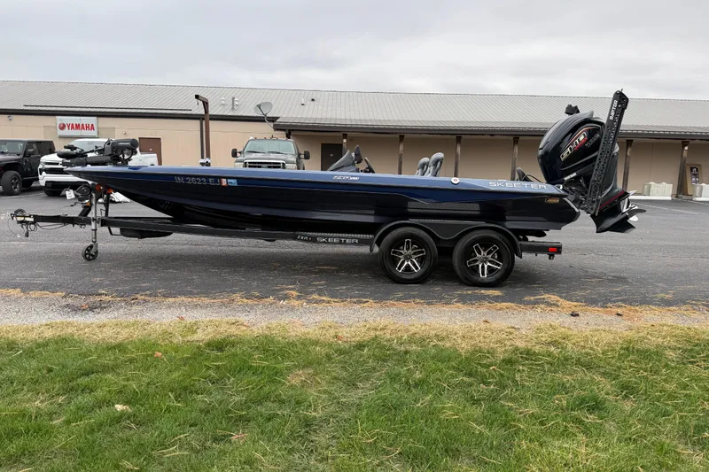Slide: The Image of 2022 Skeeter ZXR21 boat on trailer, parked outside a Yamaha dealership. - 4