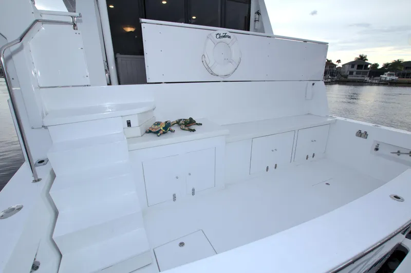 Slide: The Image of 1988 Viking 63 Cockpit Motor Yacht, spacious white deck with storage compartments. - 13