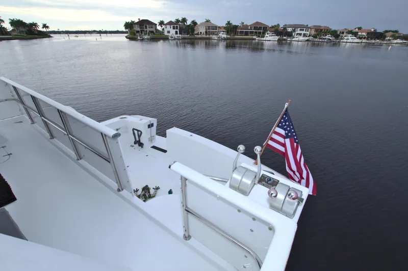 Slide: The Image of View from the deck of a 1988 Viking 63 Cockpit Motor Yacht with an American flag. - 31