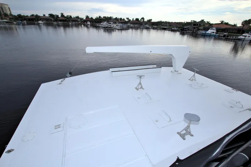Slide: The Image of 1988 Viking 63 Cockpit Motor Yacht deck overlooking calm marina. - 37