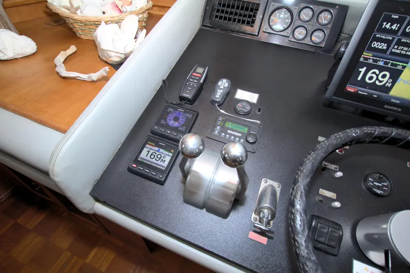 Slide: The Image of Control panel of a 1988 Viking 63 Cockpit Motor Yacht with navigation instruments. - 48