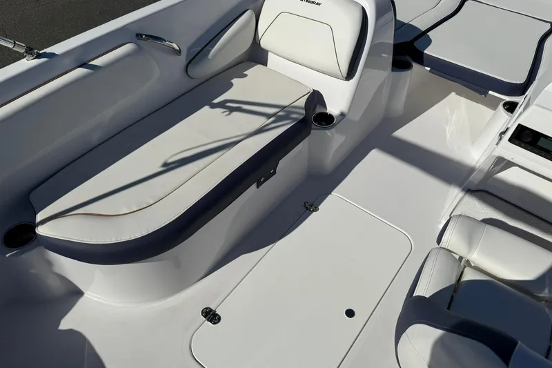 Slide: The Image of 2026 Stingray 182 SC boat interior with white seating and cup holders. - 10