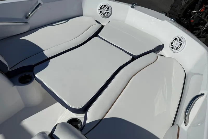 Slide: The Image of 2026 Stingray 182 SC boat interior with cushioned seating and built-in speakers. - 20