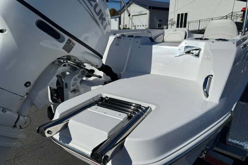 Slide: The Image of 2026 Stingray 182 SC boat with Suzuki outboard motor, featuring a sleek white design. - 8