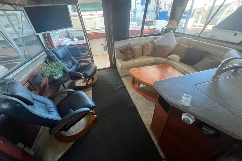 Slide: The Image of Luxurious interior of 1986 Bayliner 4550 Motoryacht with seating, table, and modern amenities. - 10