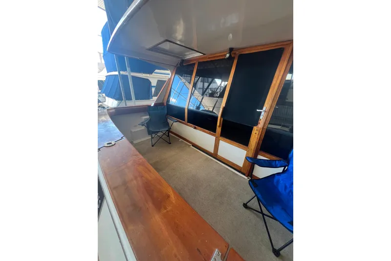 Slide: The Image of Cockpit with seating and wooden accents. - 13