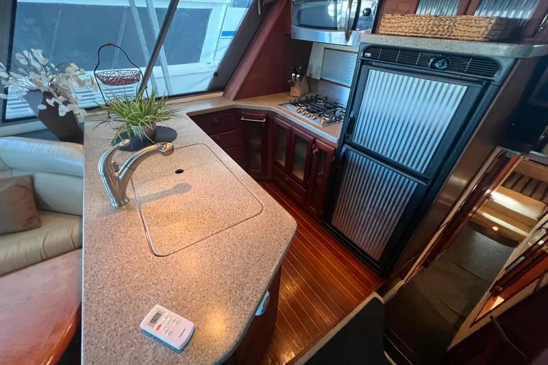Slide: The Image of Galley with modern appliances and original teak and holly wood flooring. - 14